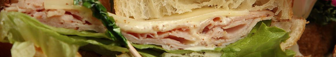 Eating Sandwich at TLC Coffee Roasters restaurant in West Kingston, RI.
